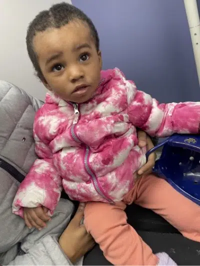 Young child recovering after pediatric traumatic brain injury surgery